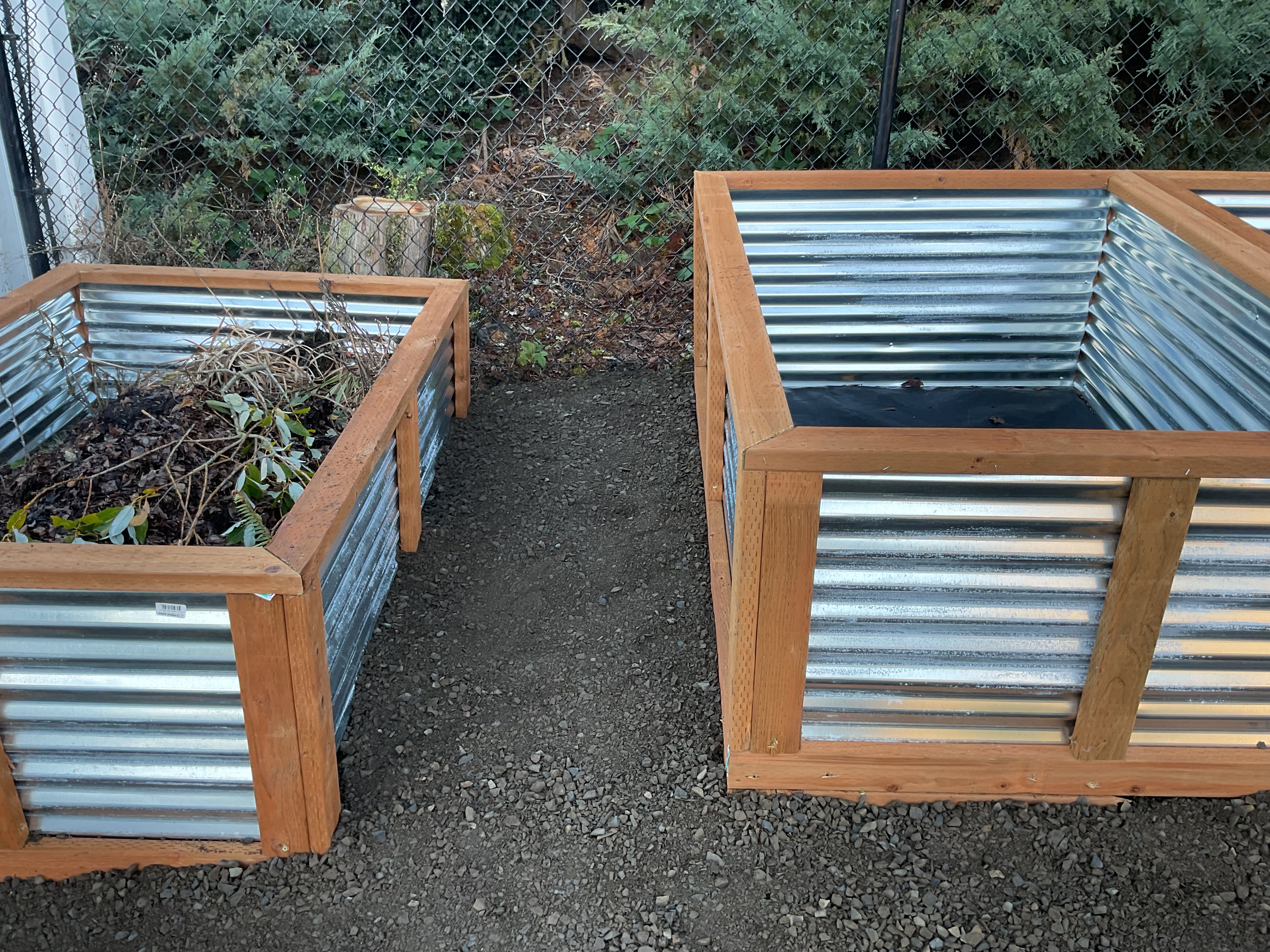 A couple of wooden planters sitting next to each other