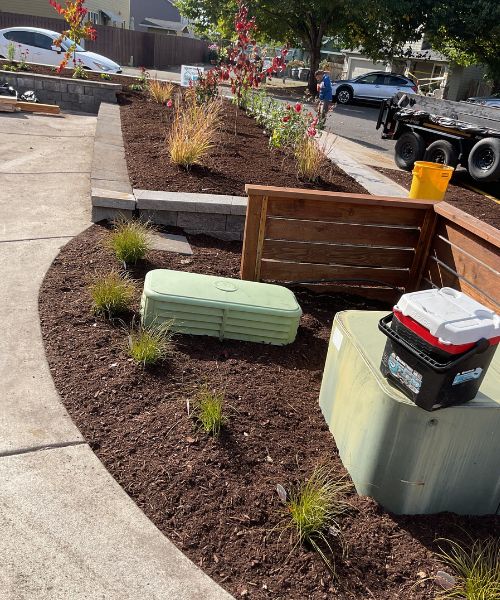 A couple of benches sitting next to each other on a sidewalk